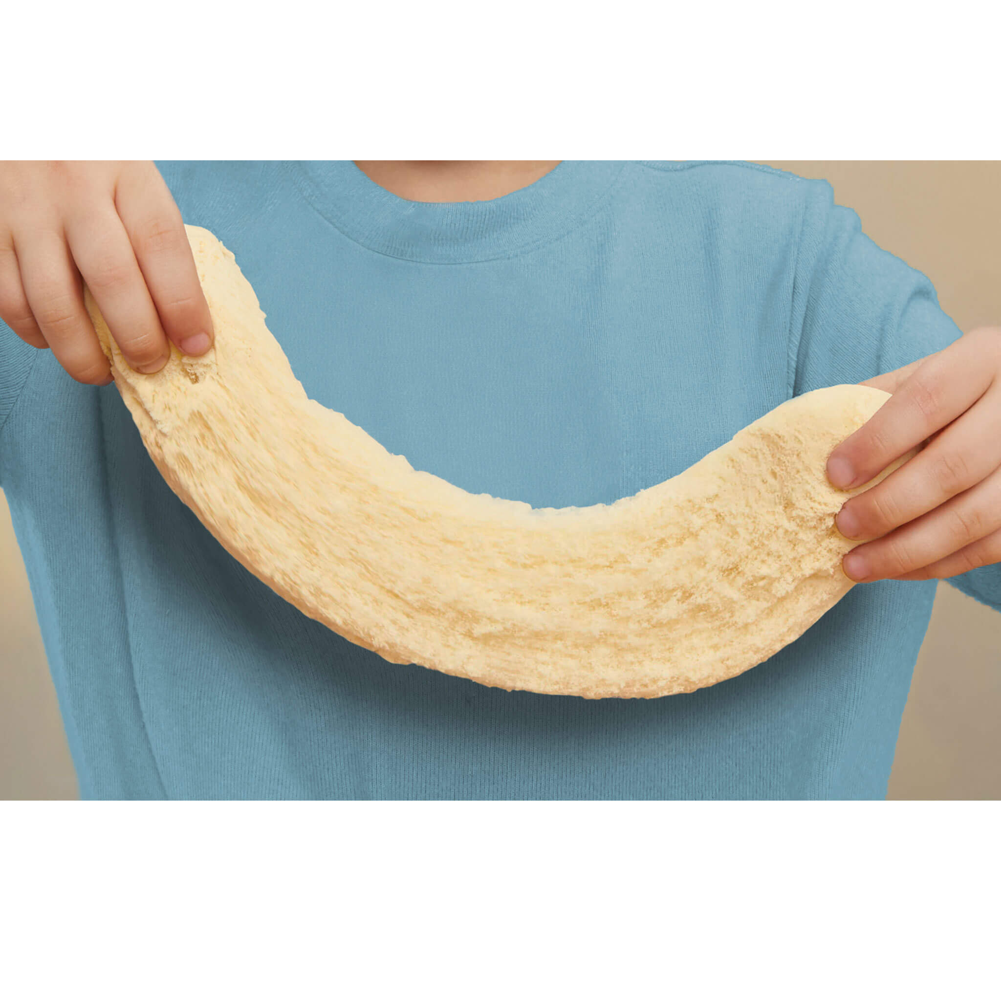 Person stretching the play sand 