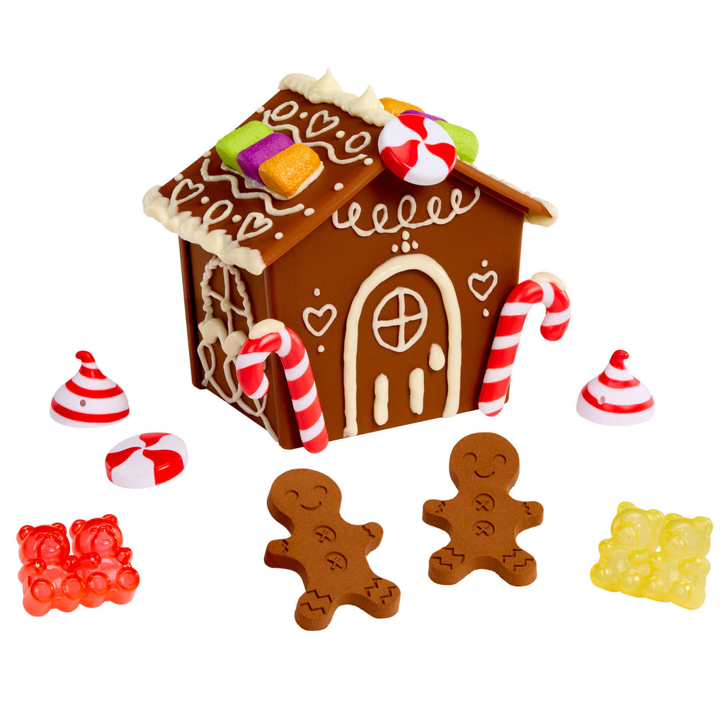 Gingerbread house and cookies on a white background