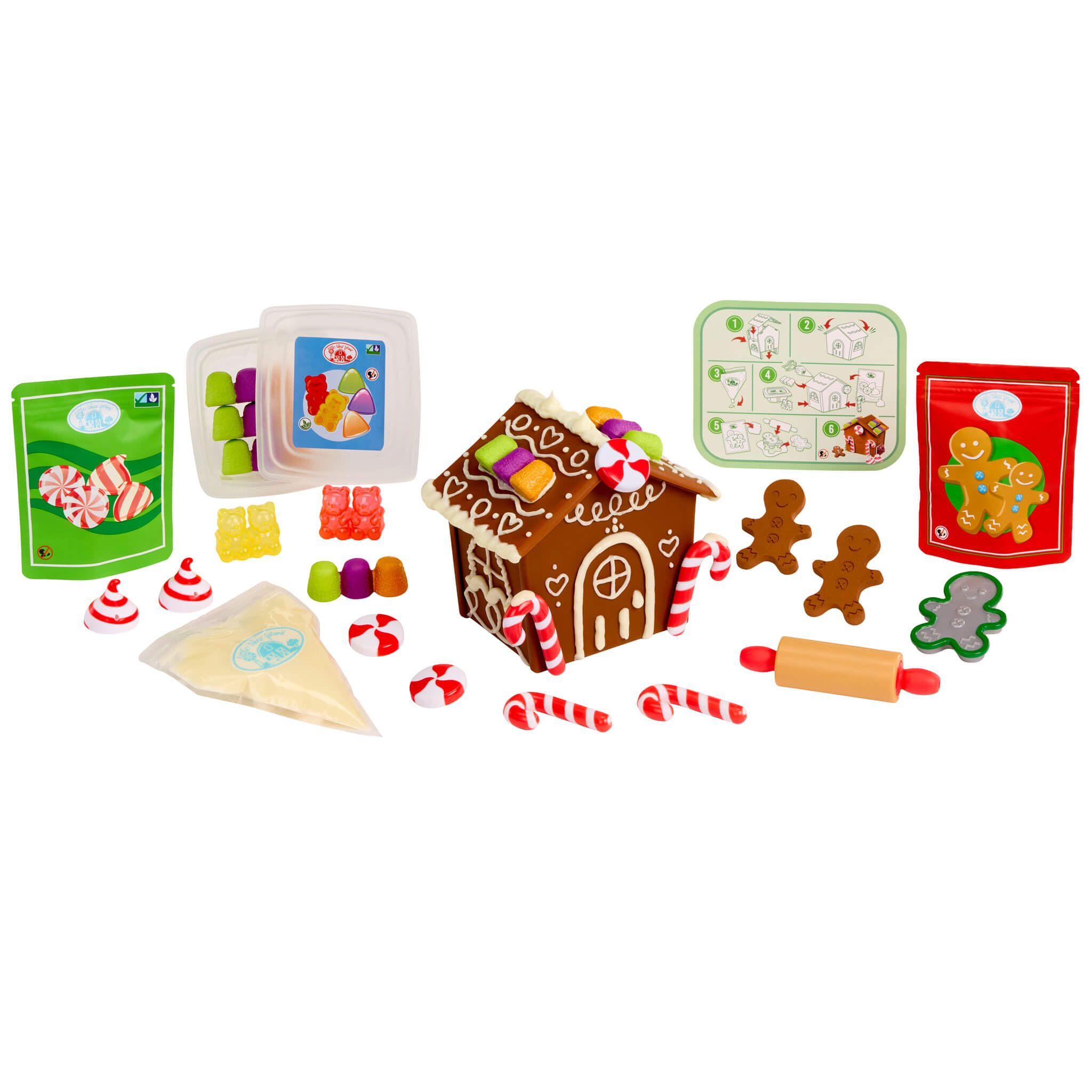 Gingerbread house kit with various gingerbread-themed items on a white background